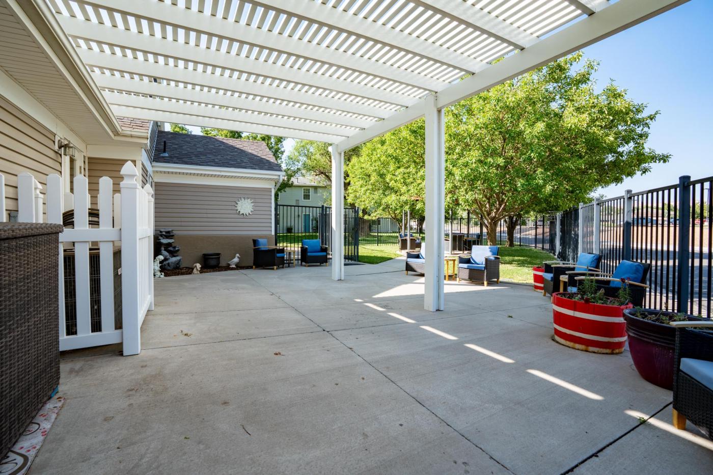 Back patio with pergola, fenced in back yard, patio furniture