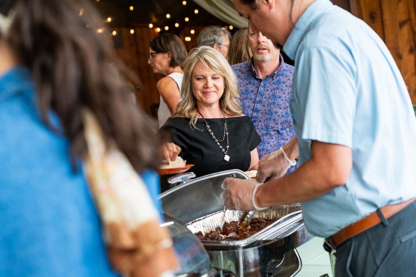 Woman waiting in line to be served at the buffet
