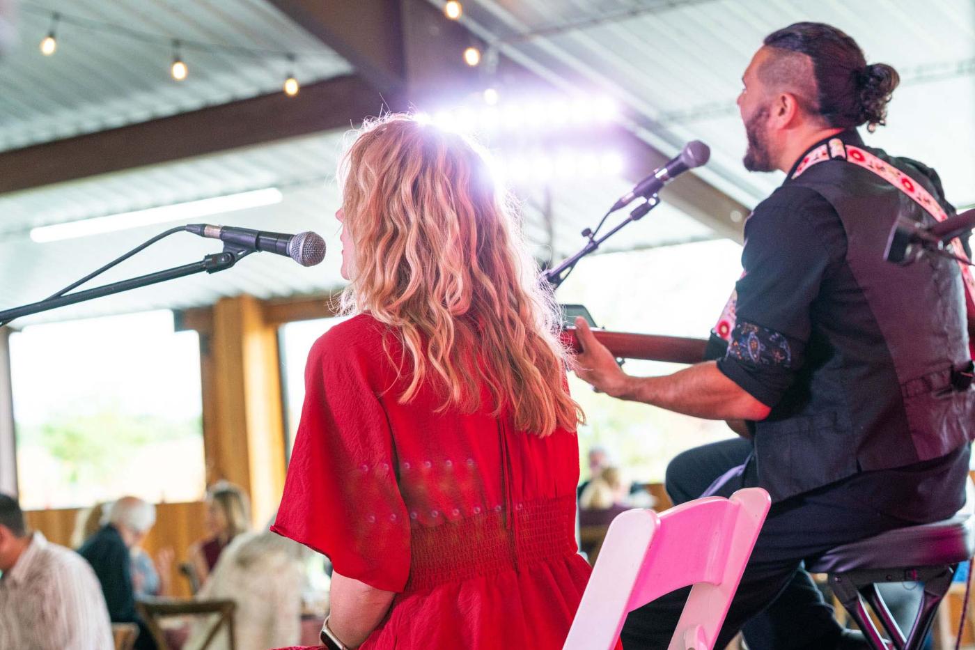Shot from behind of two musicians on stage 