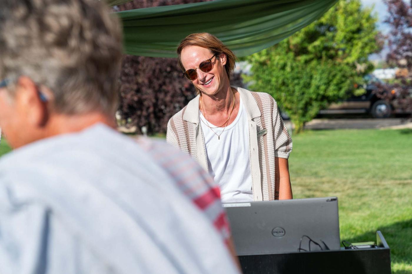 Registration attendant smiling and greeting guests