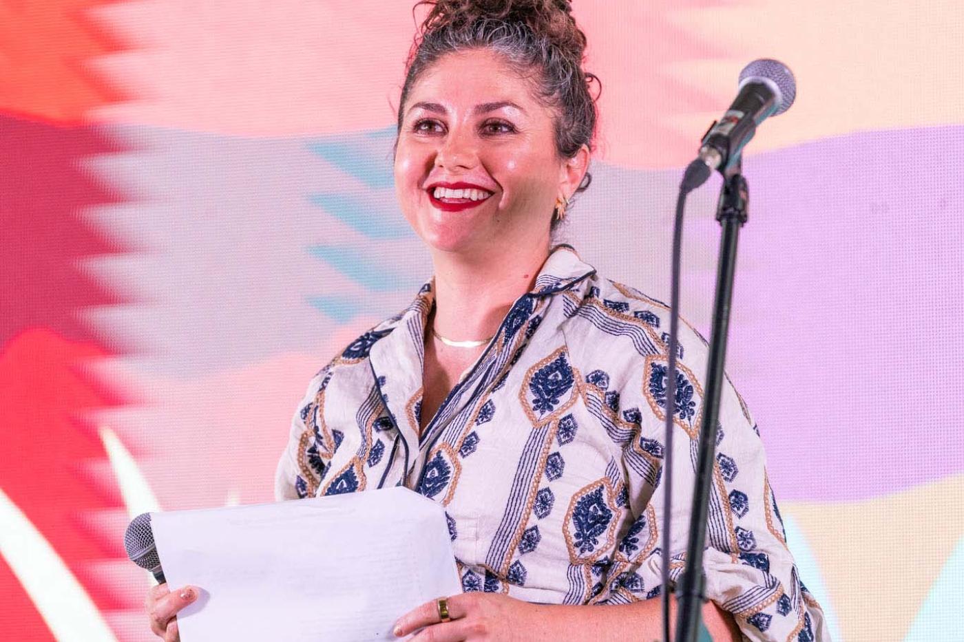 woman smiling on stage