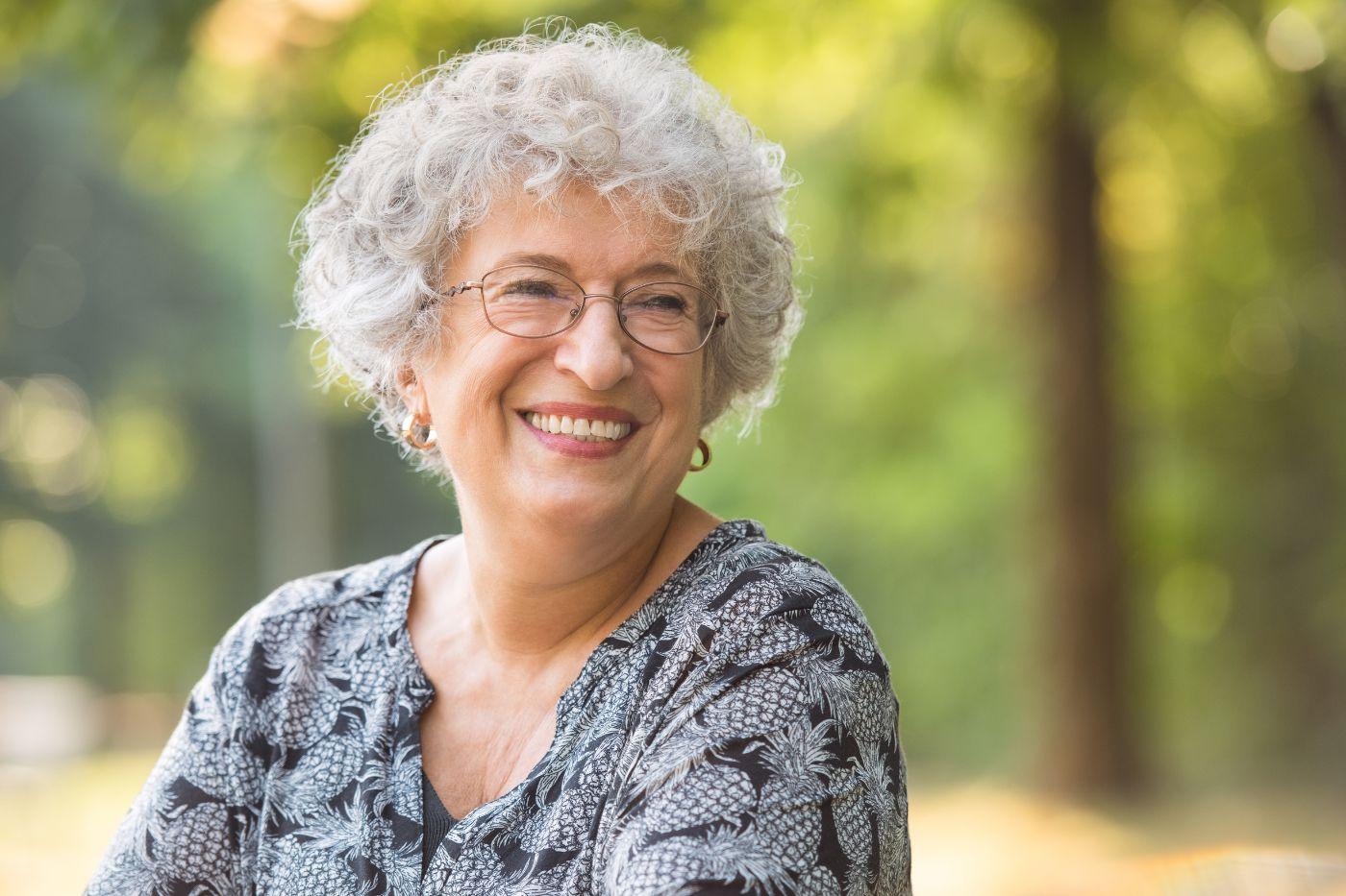Elderly woman outside smiling