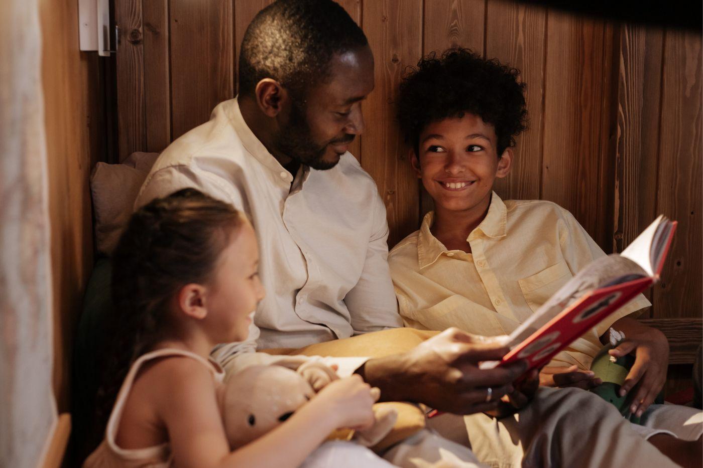 Man reading with his children